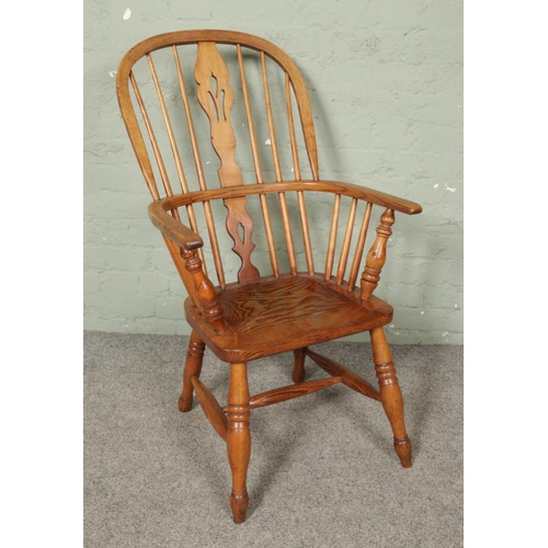 665 - An ash/elm Windsor arm chair.