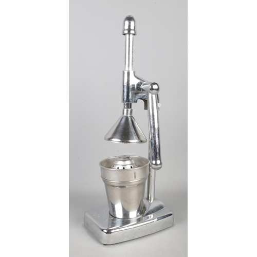 95 - A mid-century chrome and stainless steel table top juicer. Height: 39cm.