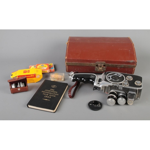 97 - A 1959 Bolex Paillard Kern B-8L Compumatic cine camera on handheld mount along with a quantity of ac... 