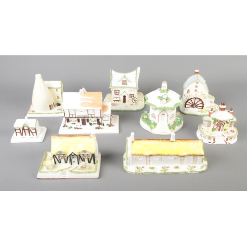 98 - A collection of nine ceramic Coalport Cottages