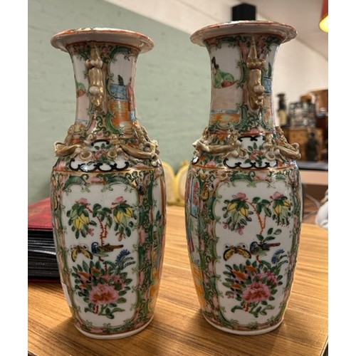 140 - A pair of 19th century Chinese Cantonese famille rose vases. 

Hx26cm