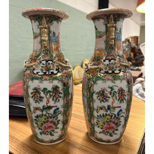 140 - A pair of 19th century Chinese Cantonese famille rose vases. 

Hx26cm