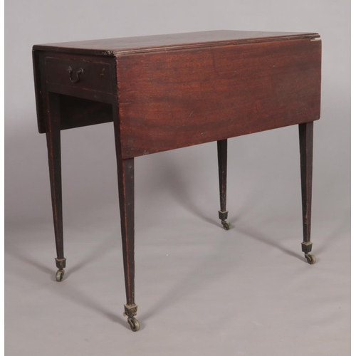 453 - A Georgian mahogany pembroke table with single drawer and tapering supports.