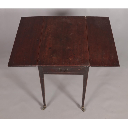 453 - A Georgian mahogany pembroke table with single drawer and tapering supports.