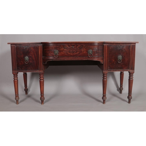 456 - A Regency mahogany sideboard. Having lion mask drawer pulls and raised on turned supports. Height 93... 