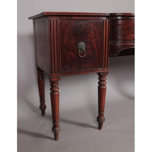 456 - A Regency mahogany sideboard. Having lion mask drawer pulls and raised on turned supports. Height 93... 