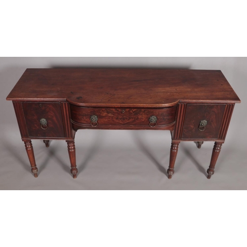 456 - A Regency mahogany sideboard. Having lion mask drawer pulls and raised on turned supports. Height 93... 