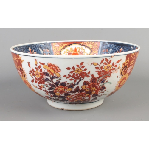 85 - An antique Chinese Imari bowl, decorated with flowers. Bearing six character marks to the base. Diam... 