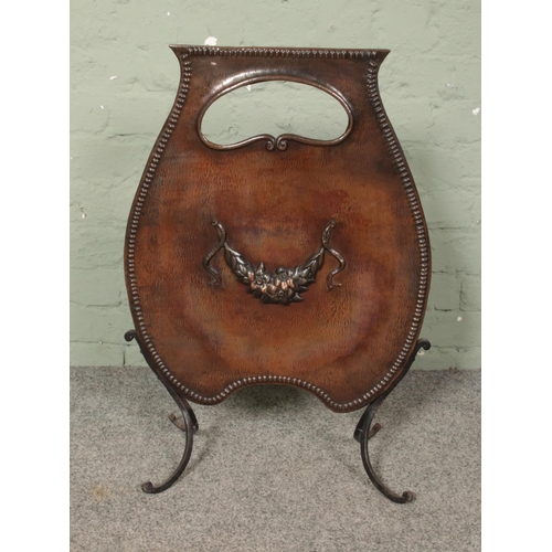 282 - An art nouveau copper fire screen featuring floral motif. Approx. dimension 48cm x 69cm.