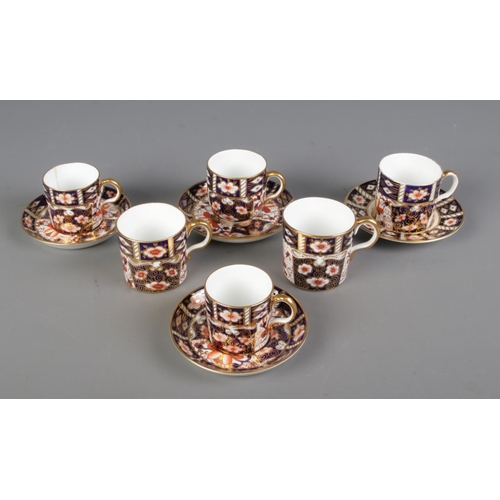 1 - A collection of Royal Crown Derby coffee can/cups and saucers in the Imari design, 2451.