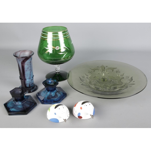 106 - A Art Deco style green glass charger with large wine glass shaped bowl, pair of glass candle sticks ... 