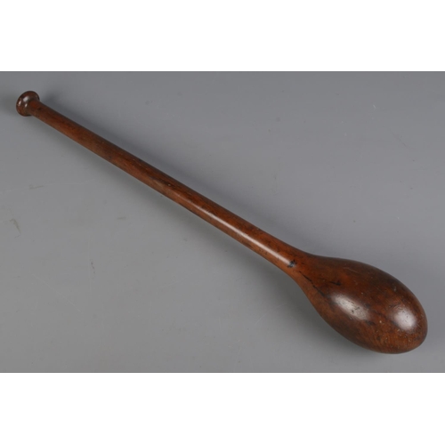 115 - A vintage turned wooden circus/juggler's club. Length 66cm.