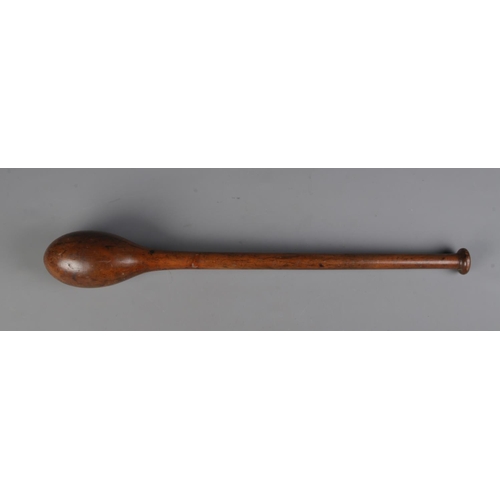 115 - A vintage turned wooden circus/juggler's club. Length 66cm.