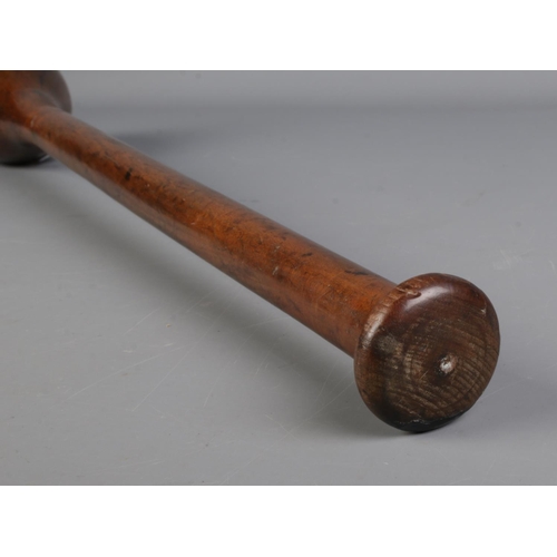 115 - A vintage turned wooden circus/juggler's club. Length 66cm.