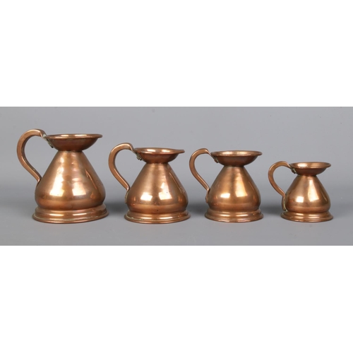 27 - A set of four graduated copper jugs, all bearing lead stamps to the rim, 'HR'. 1 Gill, 1/2 Gill, 1/4... 