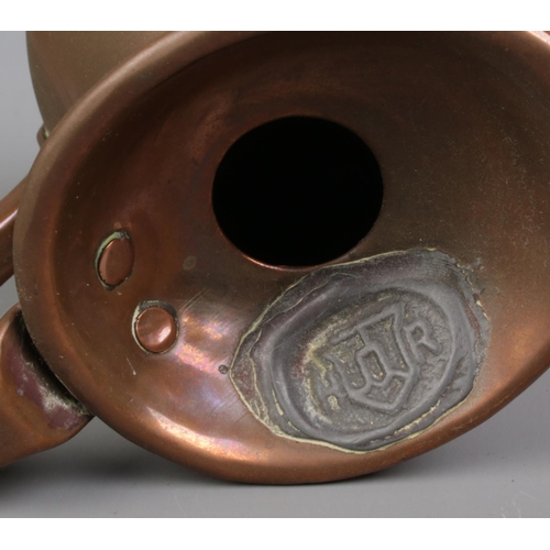 27 - A set of four graduated copper jugs, all bearing lead stamps to the rim, 'HR'. 1 Gill, 1/2 Gill, 1/4... 