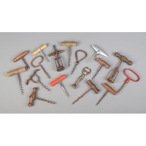 30 - A white metal box containing a large collection of antique and vintage corkscrews.