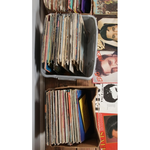 198 - Three boxes of assorted vinyl records and singles of mainly rock and pop to include U2, Elvis Presle... 