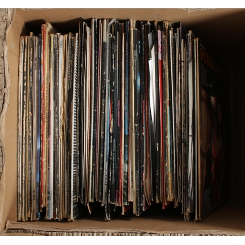 201 - Two boxes of assorted vinyl records and singles of mainly rock and pop to include Depeche Mode, ACDC... 