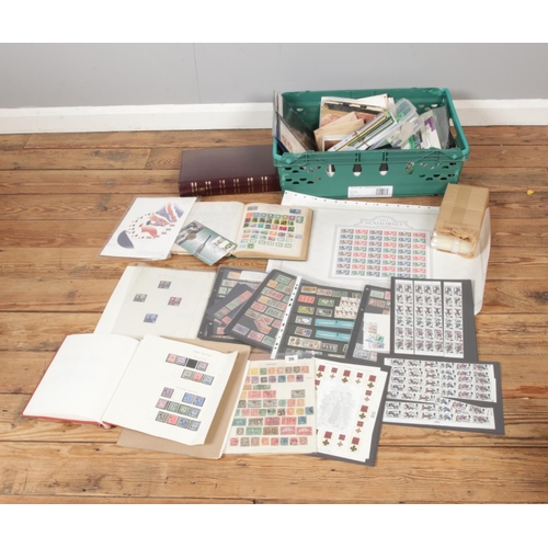 222 - A box of assorted stamps and first day covers to include book containing a good collection of world ... 