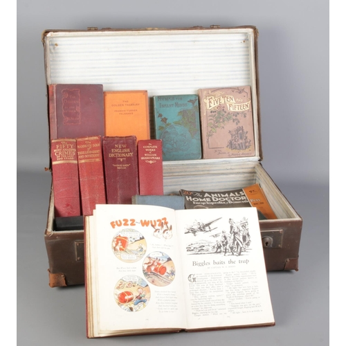 228 - A large vintage suitcase with a collection of vintage books and magazines, together with a bamboo ca... 