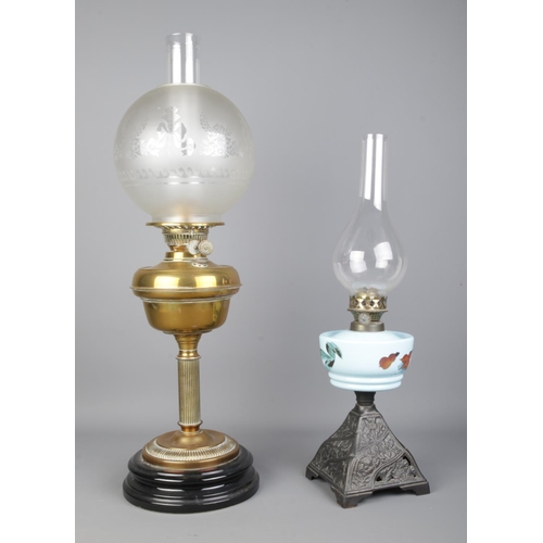 251 - Two oil lamps, including 'English Made' example with brass reservoir mounted on a Corinthian style c... 