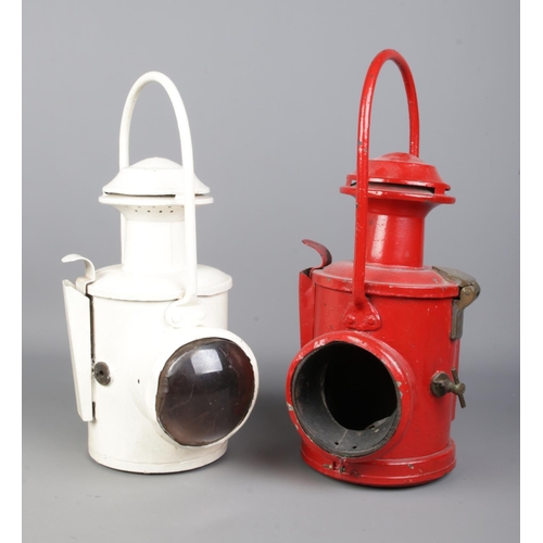 255 - Two vintage railway signal lanterns, possibly BR. One with flip up lens. The white example faintly s... 