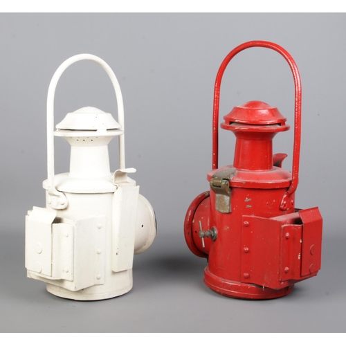 255 - Two vintage railway signal lanterns, possibly BR. One with flip up lens. The white example faintly s... 