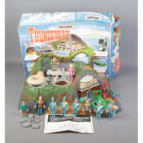 256 - A boxed Matchbox Thunderbirds Tracy Island electronic playset. Includes Matchbox figures and vehicle... 