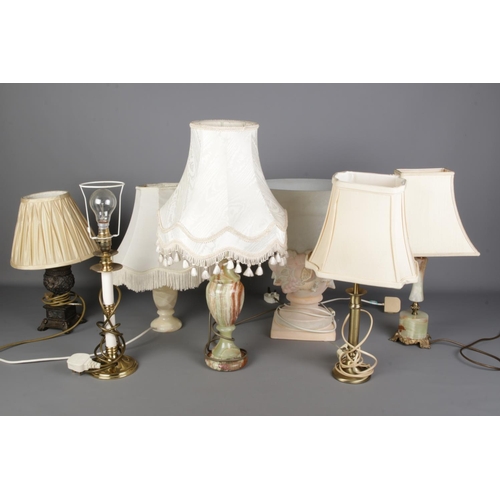 260 - A large collection of tables lamps including onyx and urn shaped varieties