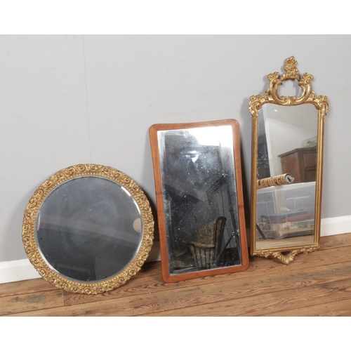 303 - Three vintage wall mirrors to include two gilt framed and one teak framed example.