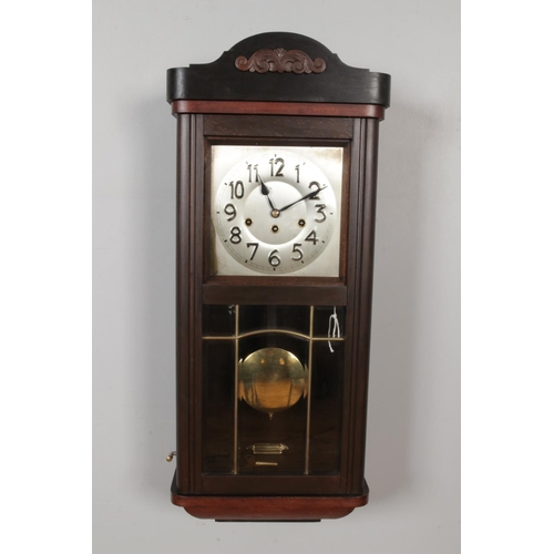 317 - A vintage Westminster Chiming Wall Clock, curved pediment with Arabic numeric dial, comes with pendu... 