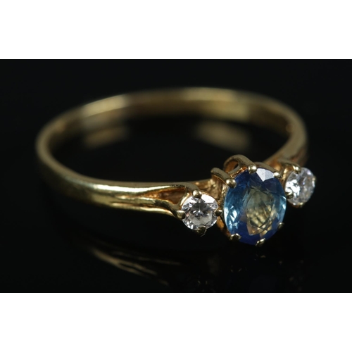 348 - An 18ct Gold Sapphire and Diamond three stone ring. Size P½. Total weight: 1.99g