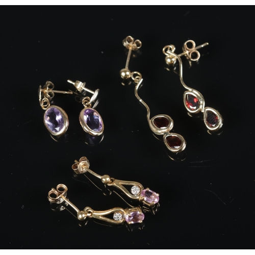 353 - A pair of 9ct gold ruby and diamond drop earrings with two other pairs of earrings one set with amet... 