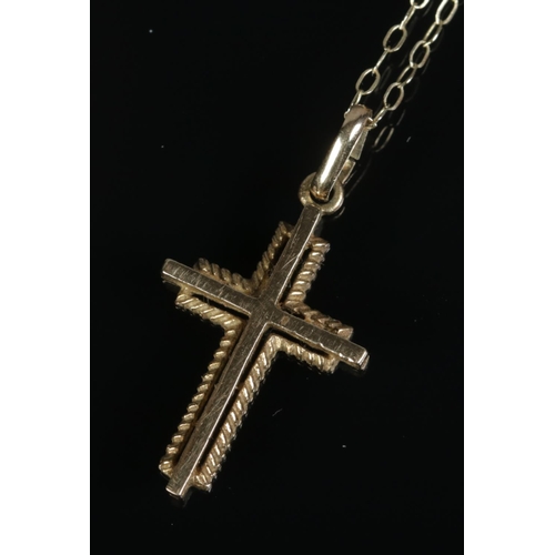 393 - A 9ct gold cross on chain.