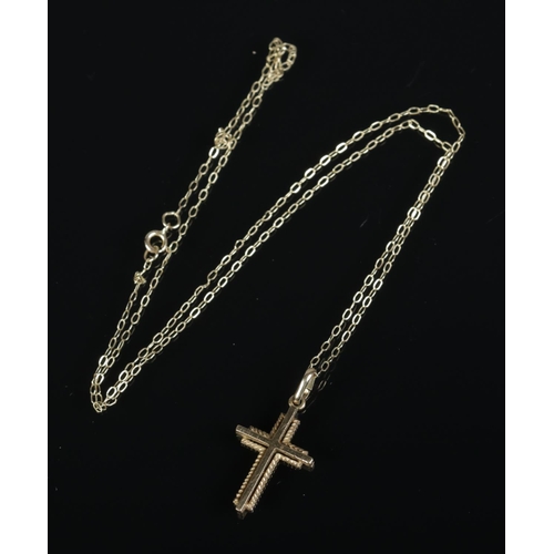 393 - A 9ct gold cross on chain.