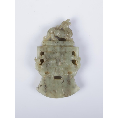 410 - A Chinese carved jade axe head pendant surmounted with a Qilin.