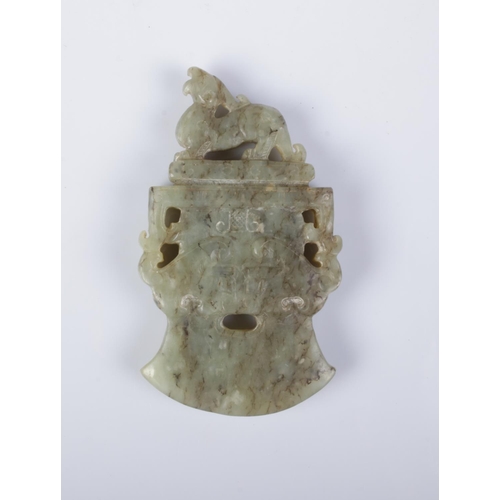 410 - A Chinese carved jade axe head pendant surmounted with a Qilin.