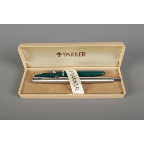 412 - Two Parker fountain pens in Parker case.