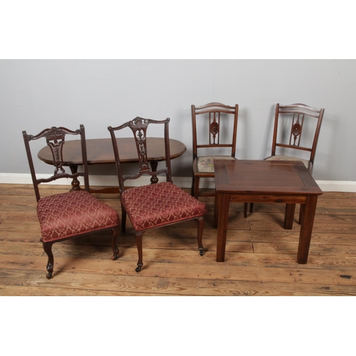 439 - Two pairs of antique chairs. Including a pair of Edwardian inlaid example with a quarter veneer maho... 