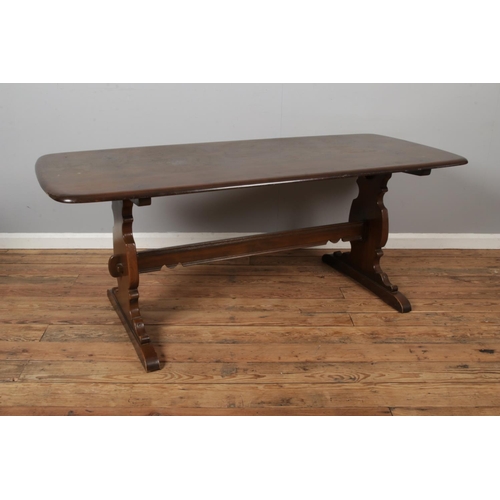 440 - An Ercol refectory dining table. 182x81cm