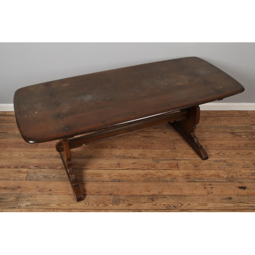 440 - An Ercol refectory dining table. 182x81cm