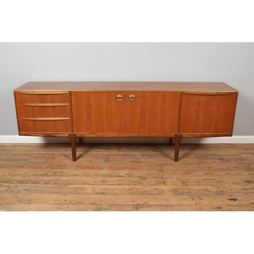 466 - An A H McIntosh & Company teak sideboard, with arrangement of three drawers, two central cupboard do... 