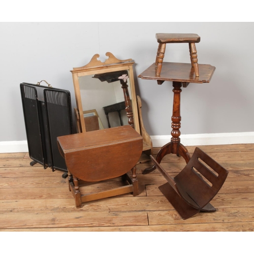 450 - A collection of furniture including a wine table, dressing table mirror, fire guard, stool etc