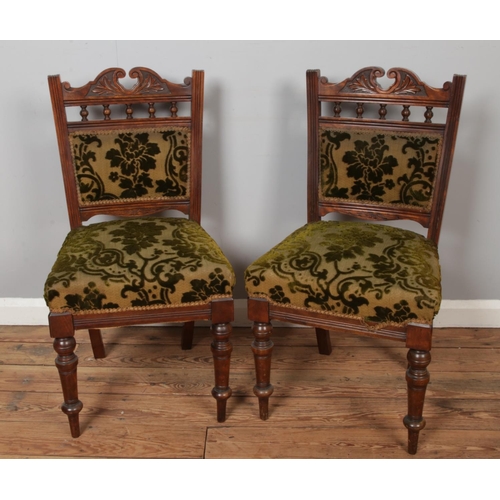 463 - A Victorian carved mahogany chaise lounge along with two matching salon chairs.