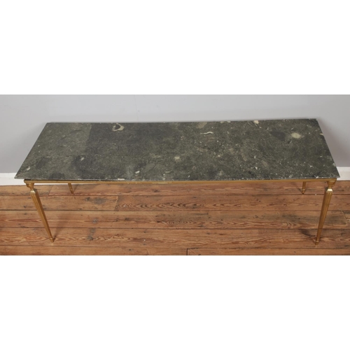 464 - A marble top coffee table raised on gilt metal base. Length 153cm.