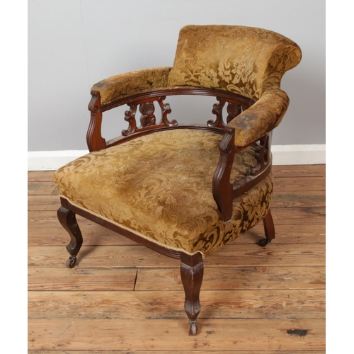 465 - A Victorian mahogany salon chair.