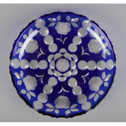 89 - A vintage Harrach blue flash glass dish, decorated with flowers. Signed to base. Diameter 29cm.