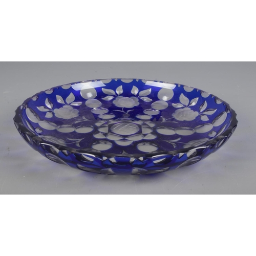 89 - A vintage Harrach blue flash glass dish, decorated with flowers. Signed to base. Diameter 29cm.