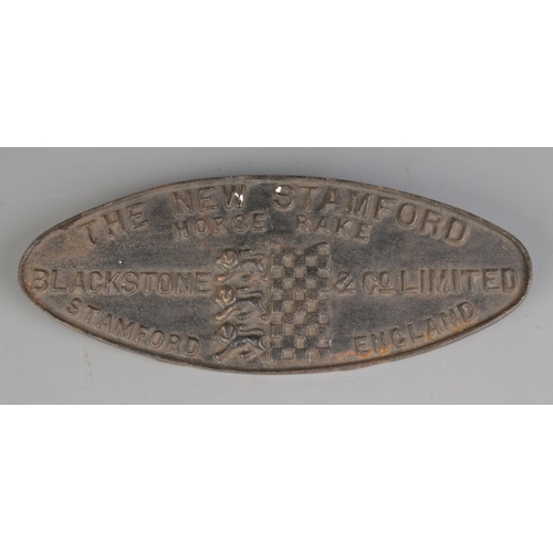 95 - An New Stamford Horse Rake cast iron plaque by Blackstone & Co. (14cm x 36cm)